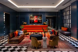 a large room filled with furniture and a flat screen tv