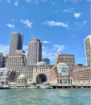 a large body of water with a city in the background