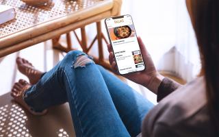 woman using phone at Palms Resort Casino to order food