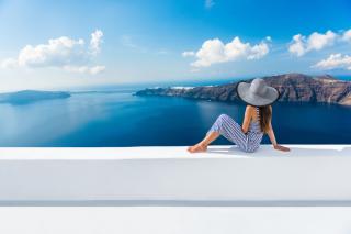Woman staring at the ocean from beach resort