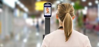 woman having her face scanned for security