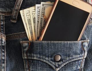 jean pocket with money and cell phone