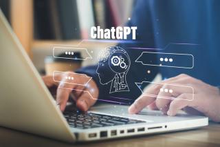 laptop with chat bubbles and chatgpt text