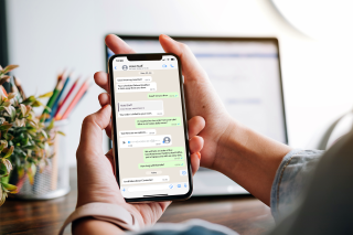person using WhatsApp on a smartphone
