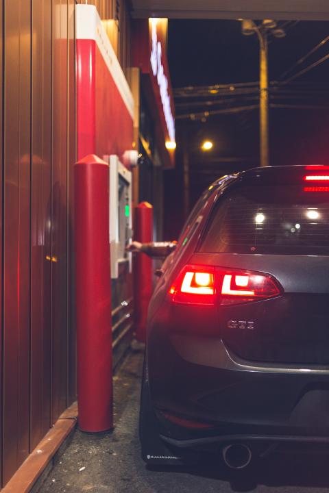 a car stopped at a train station
