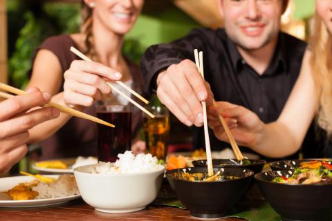 Family eating with chopsticks at a Chinese restaurant
