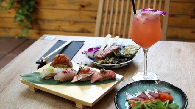 a plate of food sitting on top of a wooden table