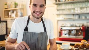 a man standing in front of a table