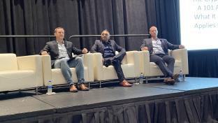 Panelists sitting on stage for the NFT, Crypto Panel at HITEC 2022